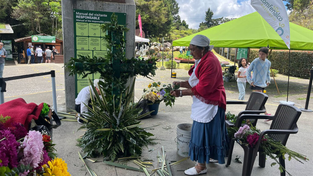 Imagen señora haciendo arreglo cruces